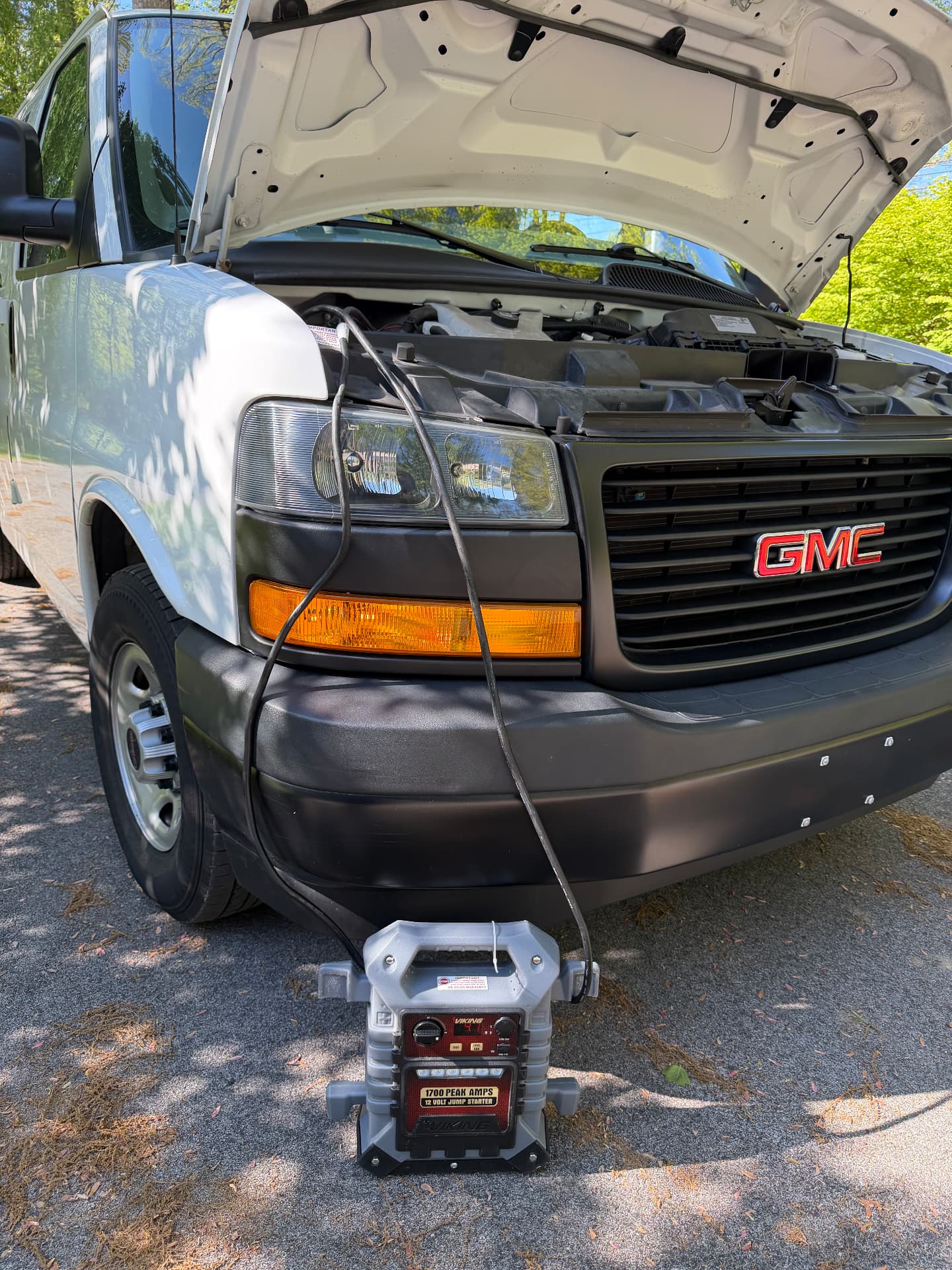Jump starting a GMC Savana cargo van with a 12V jump pack